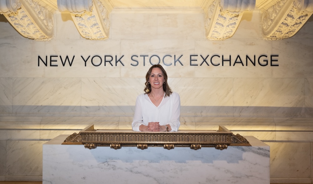 Woman standing in front of NYSE sign